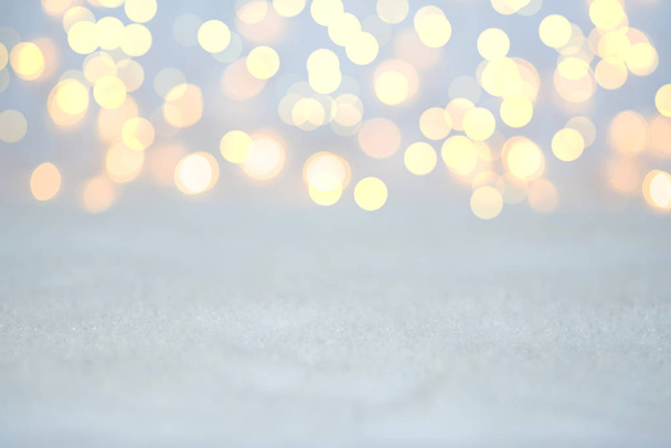 Snow and lights. Empty space white snowy table. Christmas card. - Фото, изображение