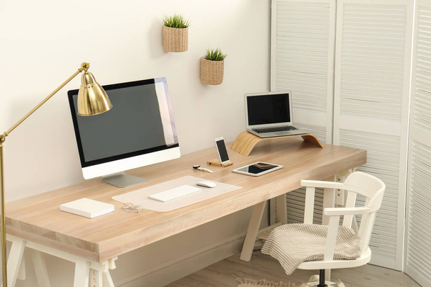 Stylish workplace interior with modern computer on table. Mockup for design - Foto, imagen