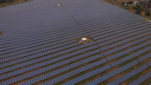 Photovoltaic solar panels absorb sunlight as a source of energy to generate electricity. The most common application of solar energy collection outside agriculture is solar water heating systems. - Footage, Video