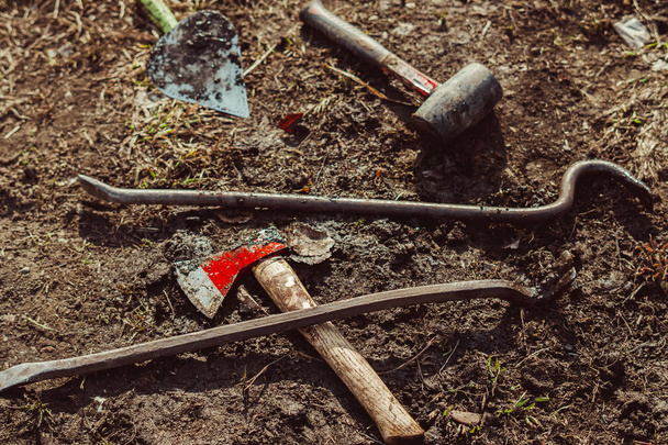 working garden tools on the ground - Фото, изображение