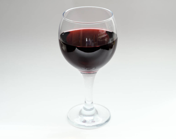 Wine in a glass on light background. Selective focus. - Photo, Image