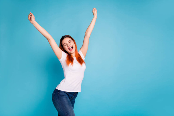 Portrait funny content lady raise hands arms scream yeah celebrate aims goals luck fortune lottery close eyes  delighted thrilled free time weekend isolated  modern youth clothing blue background - 写真・画像