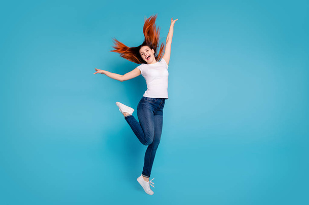 Full length body size view portrait of her she nice attractive cheerful cheery ecstatic girl wearing white tshirt having fun time weekend isolated over bright vivid shine blue background - 写真・画像