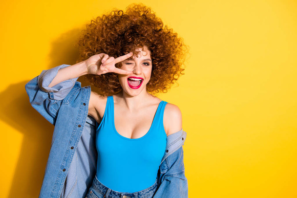 Portrait of her she nice cute lovely feminine girlish winsome charming attractive cheerful cheery optimistic girl showing v-sign isolated over bright vivid shine yellow background - Фото, зображення