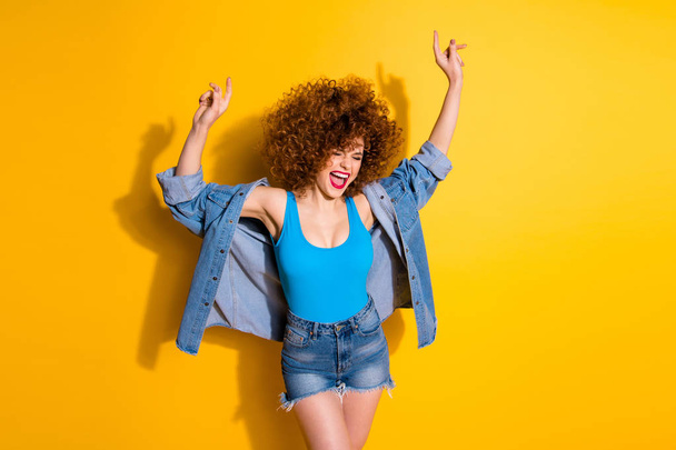 Portrait of her she nice crazy lovely charming attractive glamorous cheerful cheery overjoyed girl dancing cool free spare time isolated over bright vivid shine yellow background - Foto, immagini