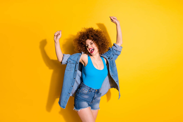 Portrait of her she nice lovely fascinating winsome charming attractive glamorous cheerful cheery crazy overjoyed girl spending free time isolated over bright vivid shine yellow background - Fotó, kép