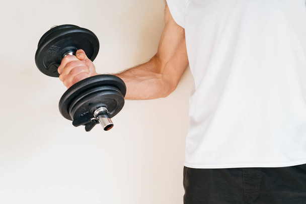 Man lifting weights at the gym - Photo, Image