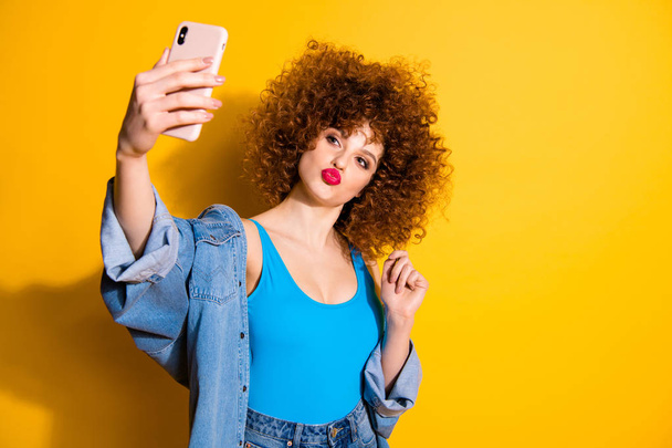 Portrait of her she nice cute glamorous charming attractive cheerful girlish wavy-haired girl taking making selfie blog blogger isolated over bright vivid shine yellow background - Φωτογραφία, εικόνα