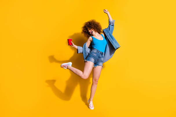 Full length body size photo funny funky she her lady wavy styling curls scream shout yell little drunk hang out wear specs casual jeans denim shirt shorts tank top clothes isolated yellow background - Valokuva, kuva