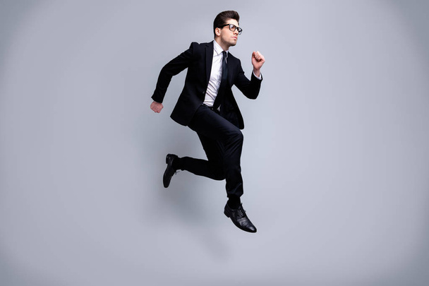 Full length body size view portrait of his he nice elegant imposing attractive worried guy diplomat white collar running fast career growth isolated on light gray background - Foto, afbeelding