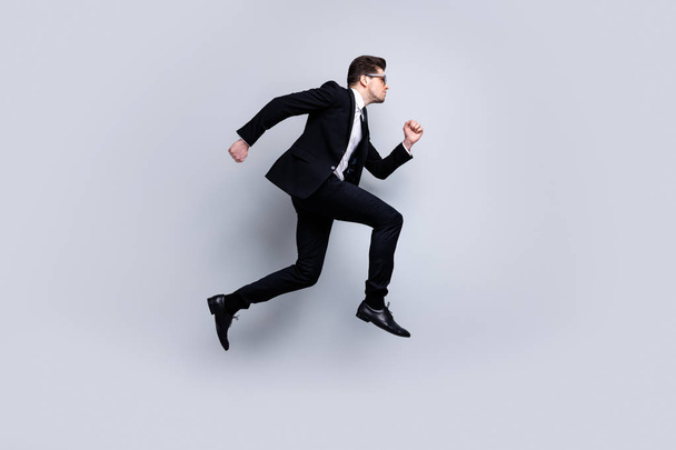 Full length body size profile side view portrait of his he nice elegant attractive confident guy diplomat white collar running fast career growth isolated over light gray background - Photo, Image