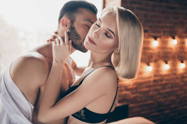Close-up portrait of his he her she nice stunning lovable attractive lovely sweet shine feminine lady enjoying romance event honey moon in loft brick industrial style interior room house - Foto, afbeelding