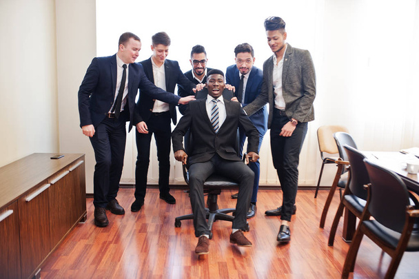 Six multiracial business mans standing at office and roll man on - Zdjęcie, obraz