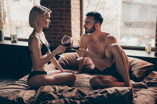 Alone weekend vacation family wife husband. Photo of beautiful stylish blonde haired bob attractive horny charming elegant lady looking into eyes of her beloved bearded sporty fit virile flirty macho - Zdjęcie, obraz