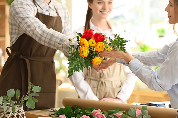 Woman buying bouquet in flower shop - Photo, image
