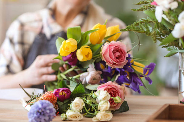Beautiful bouquet on table in flower shop - Foto, afbeelding