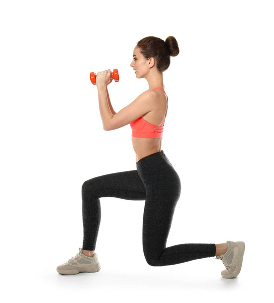 Sporty woman with dumbbells on white background - Fotoğraf, Görsel