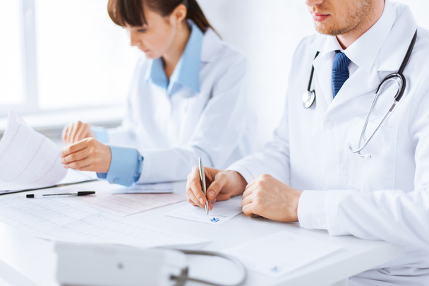 Doctor and nurse writing prescription paper - Photo, Image