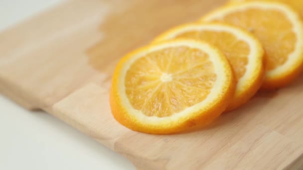 Sliced lemon and orange for cooking. Preparation of summer cocktails in fruit. - Video, Çekim