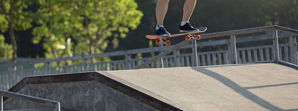 active skateboarder skateboarding in skate park   - Photo, image