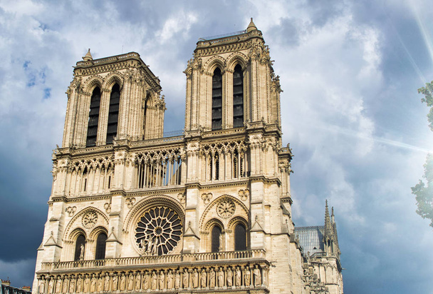 Notre Dame exterior view against a cloudy sky, Paris - Photo, Image