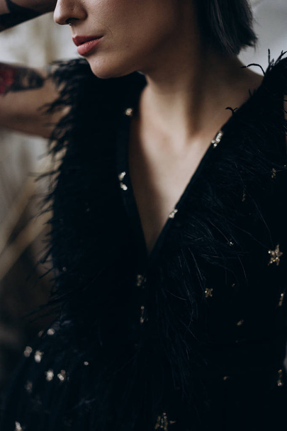 close up view of young woman wearing black dress - Φωτογραφία, εικόνα