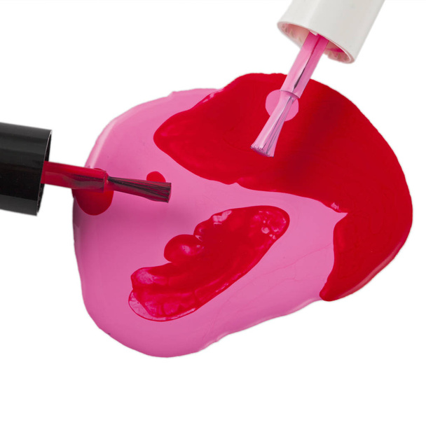 Garrafa do esmalte vermelho anmd rosa isolado
 - Foto, Imagem