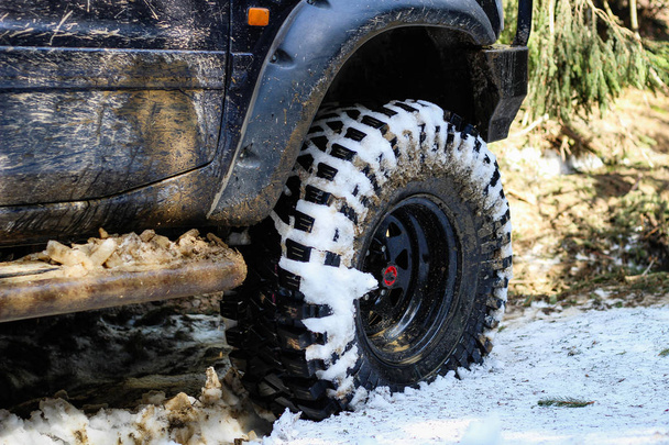 Wheels in the marsh. Offroad on Jeep in the Carpathian Mountains - Photo, Image