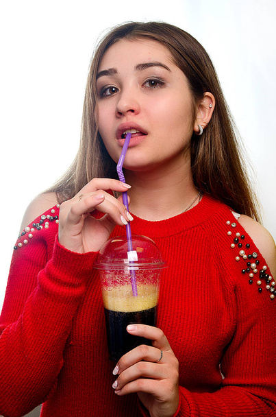 portrait of a girl with a cocktail in the Studio - Фото, изображение