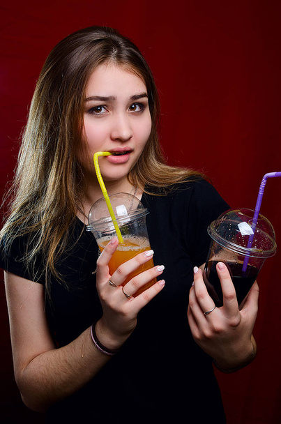 portrait of a girl with a cocktail in the Studio - 写真・画像