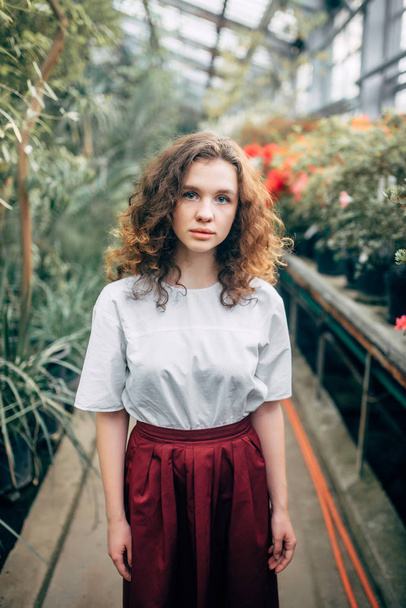 The young girl walks in a summer garden - Zdjęcie, obraz