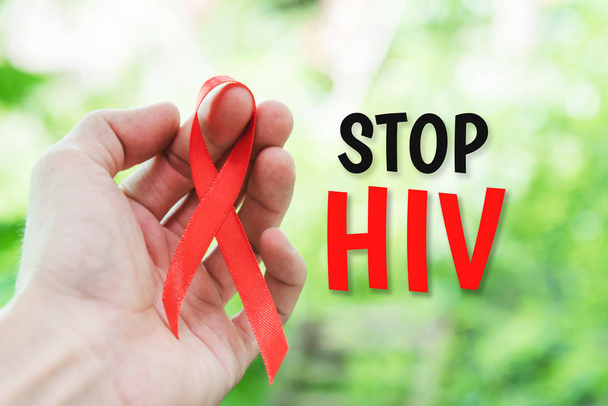 Stop HIV text for immunodeficiency virus disease red ribbon symb - Fotoğraf, Görsel