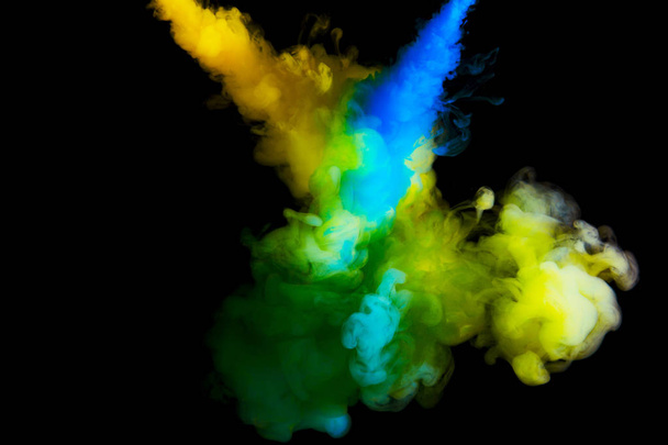 paint cloud in water, abstract background, process of mixing multicolored dye on a black background - Foto, Bild
