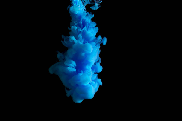 paint stream in water, colored ink cloud, abstract background, process of liquefaction blue dye on a black background - Valokuva, kuva