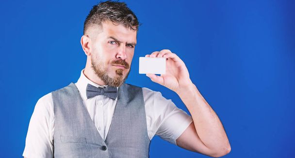 Keeping your company top of mind. Businessman with bank card. Bearded man holding business card. Hipster with credit card. Empty card for your contact information, copy space - Photo, Image
