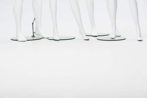 white plastic mannequin legs on white with copy space - 写真・画像