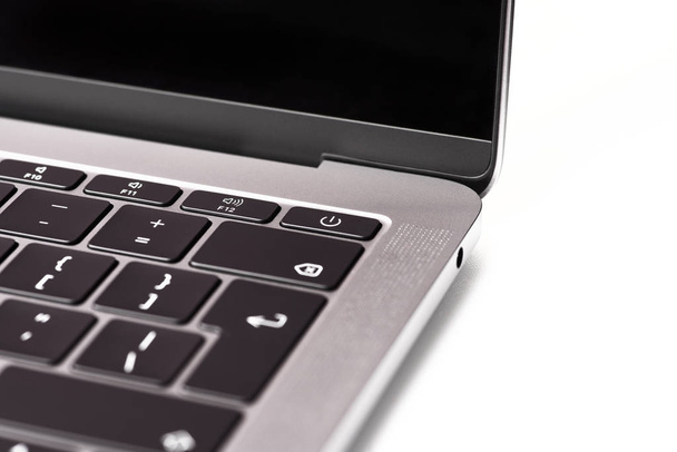 Close up of the laptop keyboard. Black keys on a light background. Silver scratched texture background. - Fotoğraf, Görsel