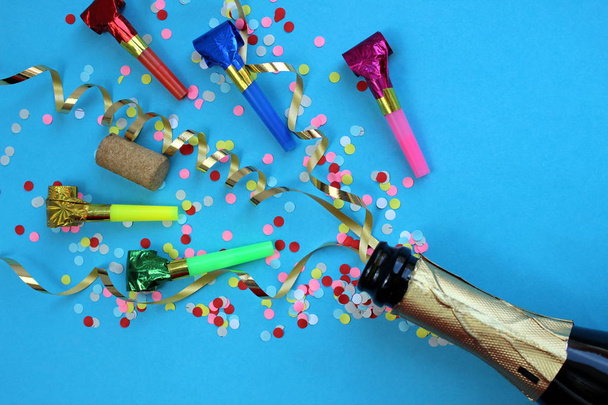 Festive ribbons, confetti and pipes flew out of the champagne bottle - 写真・画像