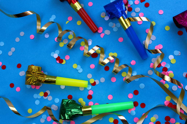 Festive ribbons, confetti and pipes, festive mood - Photo, Image