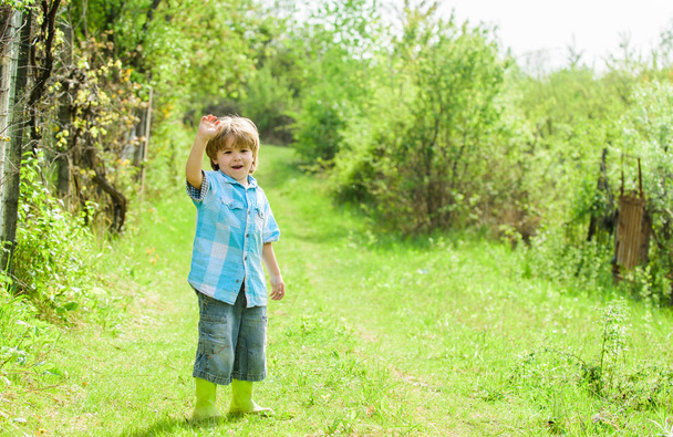 human and nature. earth day. Eco life. summer activity. small kid gardener walking in forest. farming and agriculture. copy space. happy child farmer in rubber boots, spring. New green life - Fotoğraf, Görsel