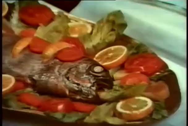 Close-up of cooked fish with white eye - Кадри, відео