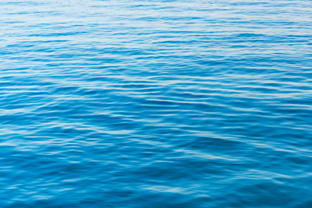 The texture of the surface of the water. The waves on the lake. Rest in Kyrgyzstan. Trip to Issyk-Kul lake. - Photo, Image
