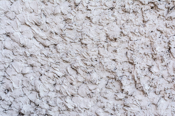 gray texture of a concrete wall, layer of decorative plaster, abstract background - Foto, immagini