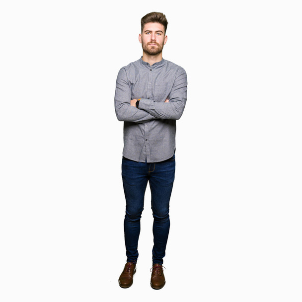 Young handsome business casual man skeptic and nervous, disapproving expression on face with crossed arms. Negative person. - Fotoğraf, Görsel