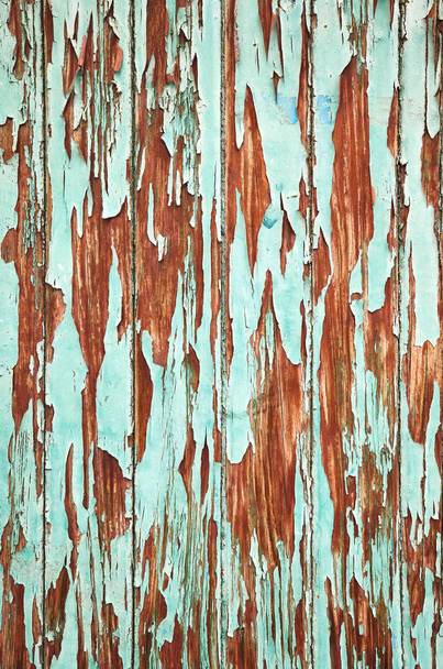 An old wooden wall with peeling paint. - Fotó, kép
