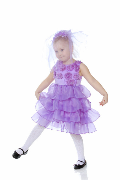 Little girl in purple dress. - Foto, Imagem
