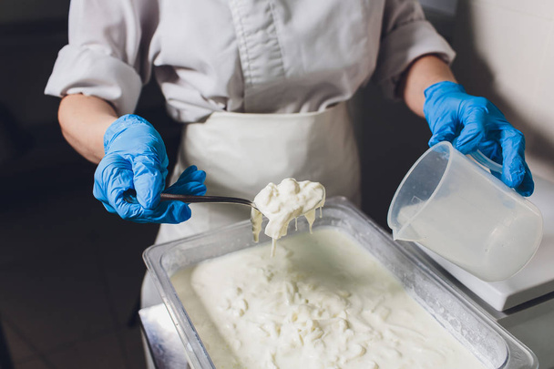 Traditional Cheese Making In A Small Company. Cheese Maker Hands Close-up Top View. - 写真・画像