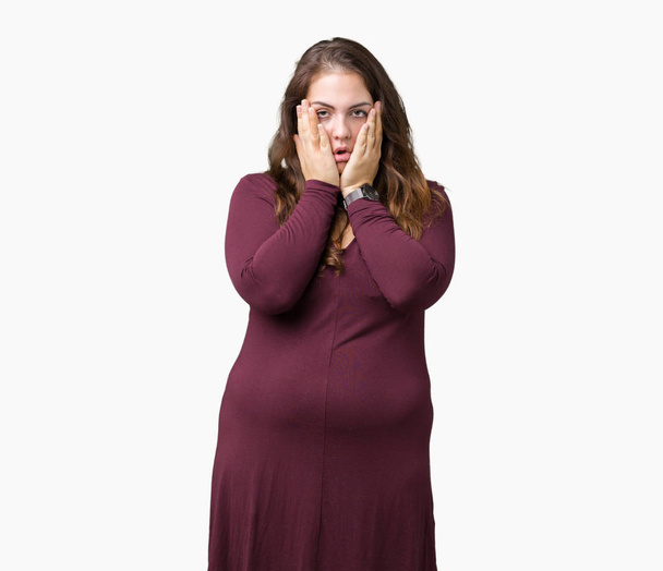Beautiful and attractive plus size young woman wearing a dress over isolated background Tired hands covering face, depression and sadness, upset and irritated for problem - Fotografie, Obrázek