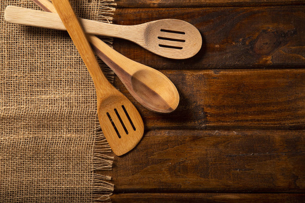 Wood spoons on wooden table. Top view - Foto, Imagen