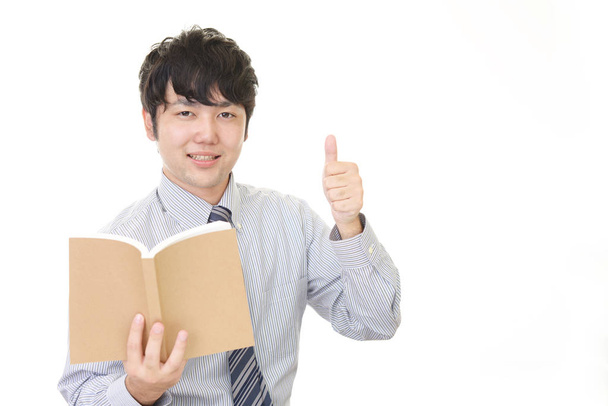 lächelnd asiatische Lehrer isoliert auf weißem Hintergrund - Foto, Bild